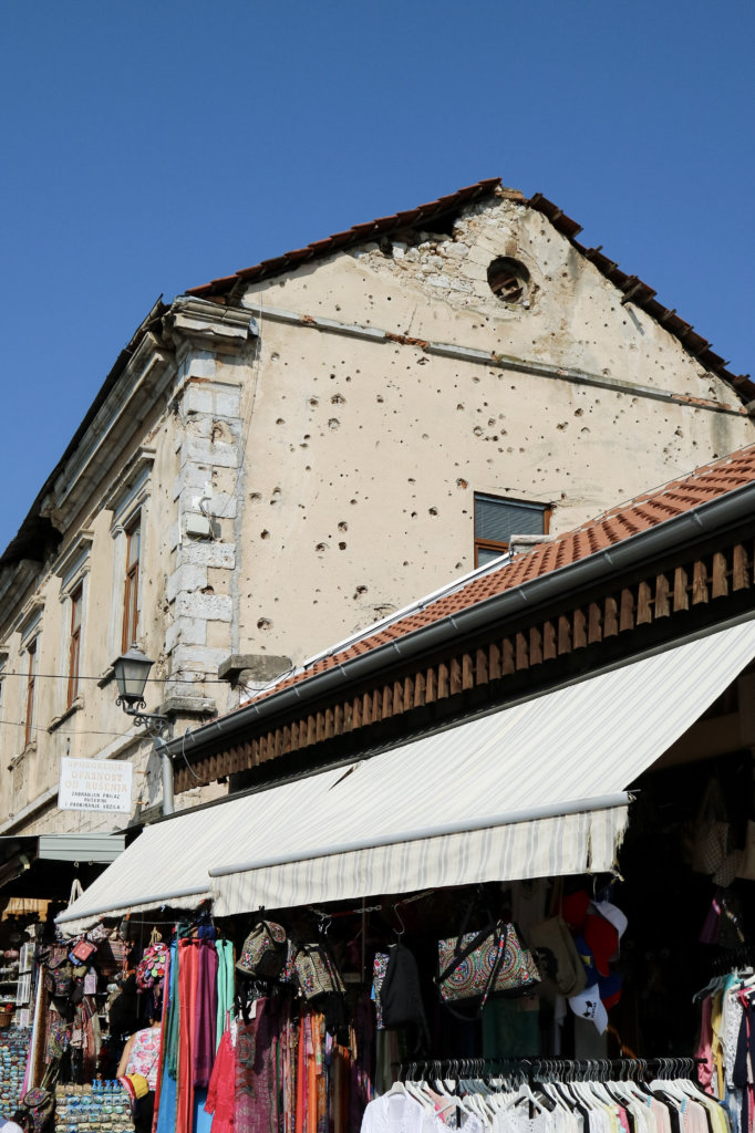 bullet holes in building Bullet Holes covering building in Old Town Mostar