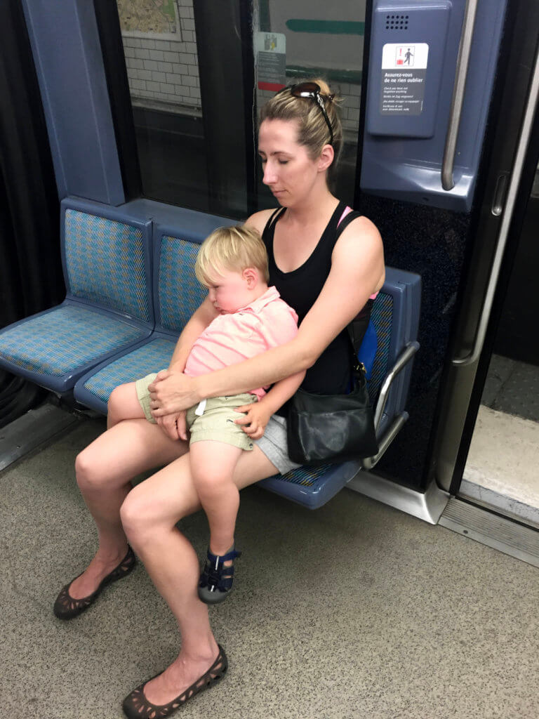 Kristin and Matthew sleeping on the subway in Paris