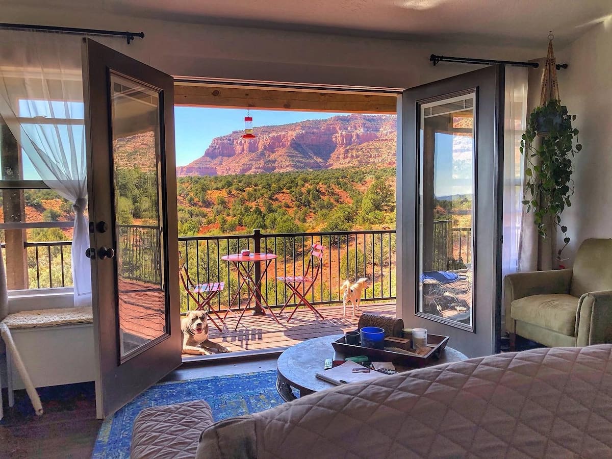 Juniper Forest Airbnb view out of living room french doors of mountains