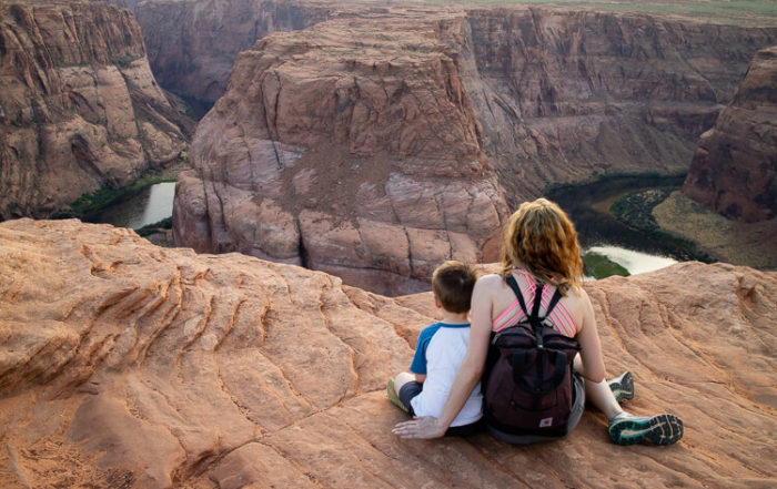 Mother and Son looking out over Horseshoe Bend in Page, Arizona